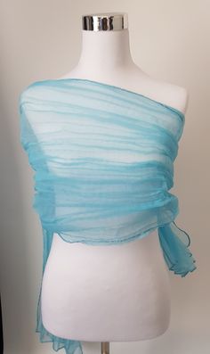 Aqua Blue organza crushed shawl.  To achieve this look, the shawl is twisted whilst wet and tied with a rope and left to dry. Beautiful shawl, will make any outfit look glamorous. Keep it or gift it.  Care Instructions Hand wash mild detergent Hang to dry naturally  Crush will remain as long as you don't iron. If you want to remove the crush affect on shawl just iron with cloth on top.  Plz note, once ironed the crush effect will not return. Thank you  Size is approximate. 200cm Length, 50cm Wid Blue Summer Party Dupatta, Blue Party Dupatta For Summer, Blue Dupatta For Summer Parties, Summer Party Blue Dupatta, Sheer Top Outfit, Sea Inspired Fashion, Organza Shawl, The Crush, Blue Organza