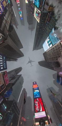 an airplane is flying through the sky over some buildings and billboards in new york city