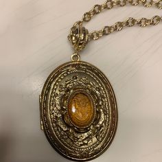 Lovingly Worn Vintage Locket With Amber Colored Stone With Lady Design. 26 Inch Drop Gold Tone Chain. Intricate Design. Vintage Lockets, Amber Color, Locket Necklace, Gold Pendant, Locket, Stone Color, Designing Women, Womens Jewelry Necklace, Gold Tones