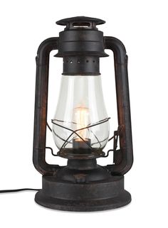 an old fashioned lantern with a light inside