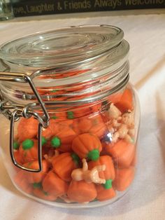 a glass jar filled with carrots and cauliflower