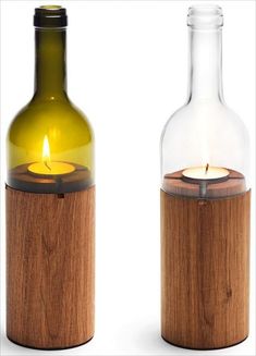 a bottle with a candle in it next to a glass bottle that has a light inside