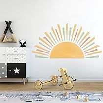 a kid's room with a bike and sun decal on the wall