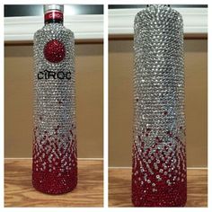 the bottle is made out of silver and red beads