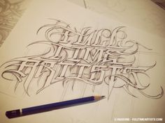 some type of lettering that is drawn on paper