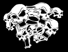 a bunch of skulls that are in the shape of a skull on a black background