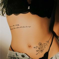 a woman with a tattoo on her stomach