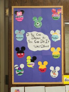 a bulletin board with some mickey mouse magnets on it's front and back