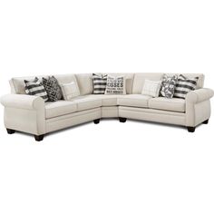 a white sectional couch with pillows on the top and bottom corner, in front of a white background