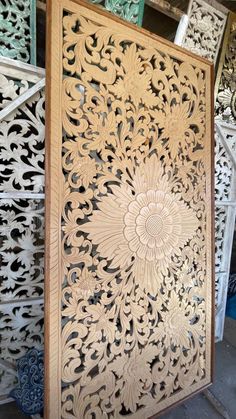 an intricately carved wooden panel in various colors