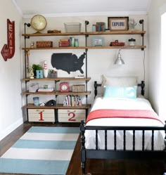 a bed room with a neatly made bed and shelves