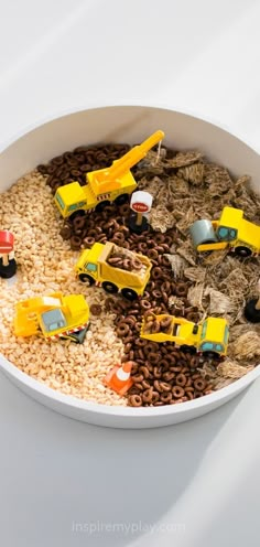 a bowl filled with lots of toys on top of rice