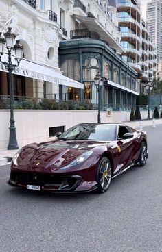 a red sports car is parked on the street