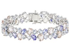 6.25ctw Oval Tanzanite, 6.25ctw Round Aquamarine, 6.25ctw Oval Morganite, And 0.20ctw Round White Zircon Rhodium Over Sterling Silver Bracelet. Measures Approximately 0.47"W. Hidden Box Clasp With Double Safety. Stainless Steel Tongue. Accent stones primarily zircon. Silver Multi-stone Diamond Bracelet, Sterling Silver Gemstone Bracelet, Fine Jewelry Silver Diamond Bracelet With Multi-stones, Elegant Multi-stone Oval Tennis Bracelet, Elegant Oval Multi-stone Tennis Bracelet, Formal White Gold Multi-stone Tennis Bracelet, Oval Multi-stone Tennis Bracelet In Fine Jewelry Style, Formal Multi-stone Cubic Zirconia Tennis Bracelet, Elegant Silver Multi-stone Diamond Bracelet