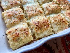 a casserole dish filled with cheese and sauce