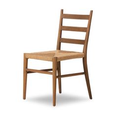 a wooden chair with a wicker seat and back rests against a white background,