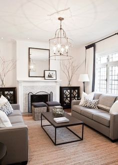 a living room filled with furniture and a fire place