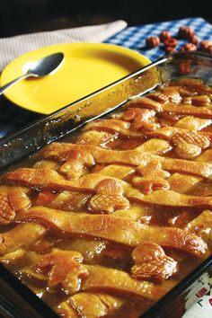 a pan filled with food sitting on top of a table