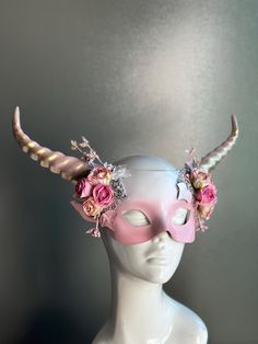 Women's mythical long horn masquerade mask in pink with roses. This Mask can be customized to match your costume colors, select the custom option!  C U S T O M I Z A T I O N Get in touch for custom orders! S I Z E  Adult size. S H I P P I N G -  Processed same day or within 24 hours.  1-2 day guaranteed delivery, add item to cart, click shipping tab for rates.  Pls leave a check out note with your need date & contact number  Msg for delivery time frames (Include your state/country) C O N T A C T Pink Themed Costume Accessories For Costume Party, Fantasy Horned Masquerade Mask For Costume, Pink Adjustable Costume Accessories For Costume Party, Adjustable Pink Costume Accessories For Costume Party, Pink Costume Accessories For Cosplay Party, Pink Costume Accessories For Cosplay Party Events, Fitted Pink Halloween Costume Accessories, Pink Halloween Costume Accessories, Pink Themed Halloween Costume Accessories