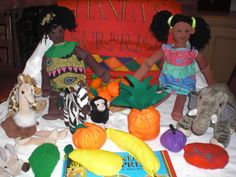 there are many stuffed animals and toys on the table with each child's name