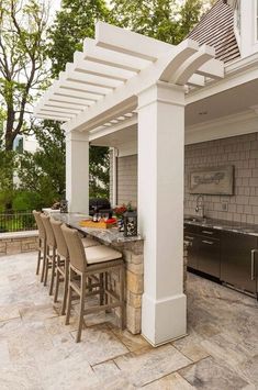 an outdoor kitchen and grill area is shown