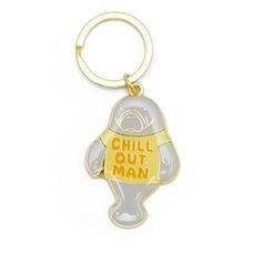 a keychain with the words chill out man on it's face and an elephant holding a sign