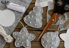 some craft supplies are laying out on a wooden table and ready to be sewn