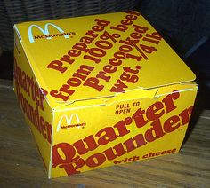 a mcdonald's box sitting on top of a wooden table