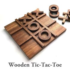 the wooden tic - tac - toe game is ready to play