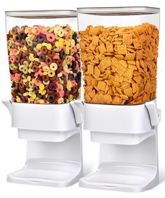 two plastic containers filled with cereal and pretzels sitting side by side on top of each other