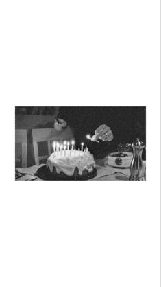 a black and white photo of a birthday cake