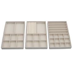 three empty trays with dividers for pens and pencils