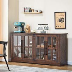 a wooden cabinet with glass doors in a living room