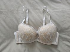 A NWT old stock Vintage Bra from Japan, in size 12B/Aus, 34B/UK and 34B/US, (D75 Japan) (see sizing chart in pictures) in a white net and lace finish with contrasting underlay. Underwired with elasticised, removable and adjustable straps and double clasp with removable padded cups. Has matching satin bow between cups. Colour - White Vintage Bra, Bra Items, Satin Bow, Bra Lingerie, Sizing Chart, Favorite Outfit, Beauty Book, Adjustable Straps, Art Collection