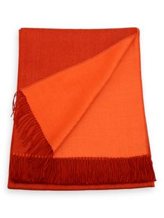 an orange and red scarf on a white background