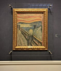 a painting on display in a museum with blue walls