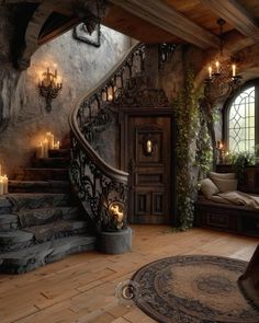 a staircase leading up to a living room with candles