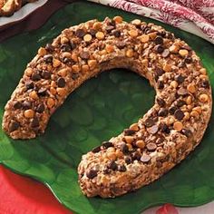 an oatmeal and chocolate cookie doughnut on a green plate