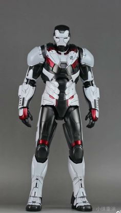 an action figure is posed in front of a gray background with white and red accents