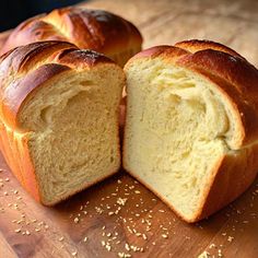 a loaf of bread cut in half on a cutting board