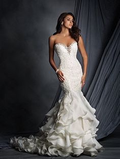 a woman in a wedding dress posing for the camera