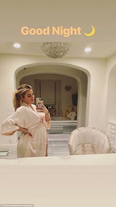 a pregnant woman taking a selfie in her bathrobe with the caption good night