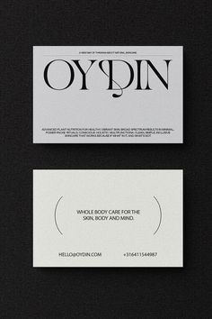 two business cards with the words oyginn on them, one in black and white