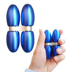 four blue egg rings are held up in front of a hand with three other ones