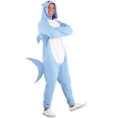 a man in a shark costume standing with his arms crossed