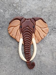 an elephant's head is made out of wood