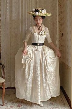 This Regency Era Ivory Jacquard Corset Dress with Lace Long Sleeves is a beautiful and classic piece of 1800s regency ball gown fashion. The intricate jacquard pattern of the fabric adds a touch of elegance to the dress, and the lace sleeves give it a romantic look. The dress also features a hidden back zipper for easy dressing. This dress is perfect for a special occasion such as a regency ball or a formal event. 1800s Fashion Women Casual, 1800s Outfits, Romantic Era Fashion, Regency Ballgown, 1780s Dress, 1800s Womens Fashion, Regency Fashion Women, 1830s Dress, 1800s Dresses