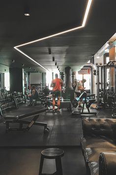 people working out in the gym with equipment