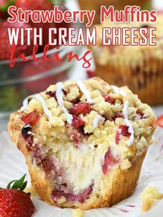 strawberry muffins with cream cheese filling and strawberries in the background on a paper plate