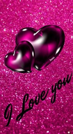 two shiny hearts with the words i love you on it in black and pink glitter